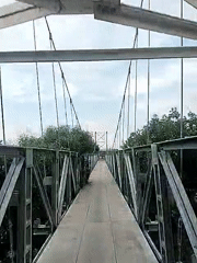 Tourist documents suspension bridge visit in Lhokseumawe, Indonesia