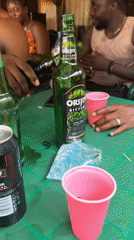 Men gather for drinks and dice games in Kurunduma
