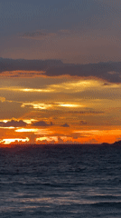 Sunset beach session with swings, shoreline walks, and vivid skies