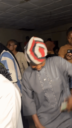 Traditional outfit and crowd energy, two angles
