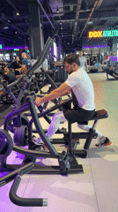 Man exercises on rowing machine at Krasnoyarsk gym