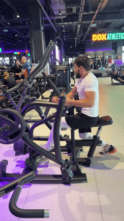 Man exercises on rowing machine at Krasnoyarsk gym