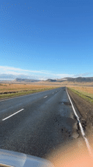 Wet Russian road captured on video under clear skies