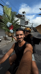 Couple takes selfie while riding scooter in North Kuta