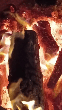 Fire burns to embers on a summer night in Viadana