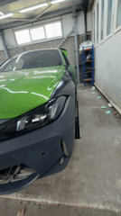 BMW M4 undergoes garage work with unpainted bumper