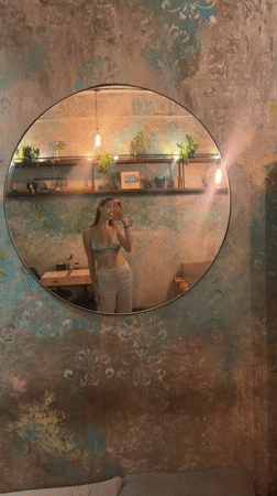Visitor documents bohemian café experience in Ubud, Indonesia