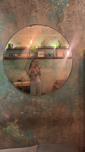 Visitor documents bohemian café experience in Ubud, Indonesia
