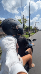Passenger films scooter ride in Gianyar, Indonesia