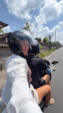 Passenger films scooter ride in Gianyar, Indonesia