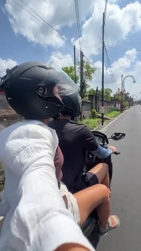 Passenger films scooter ride in Gianyar, Indonesia