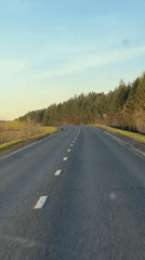 Vehicle captures nighttime drive on curved Russian road