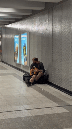Man sits in Montreal underground passageway early morning
