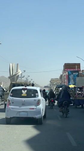 Everyday street life along a busy Kandahar road