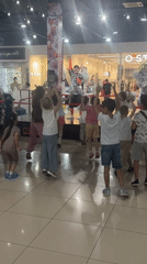 Children dance with costumed performers at Astrakhan mall