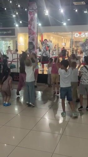 Children dance with costumed performers at Astrakhan mall