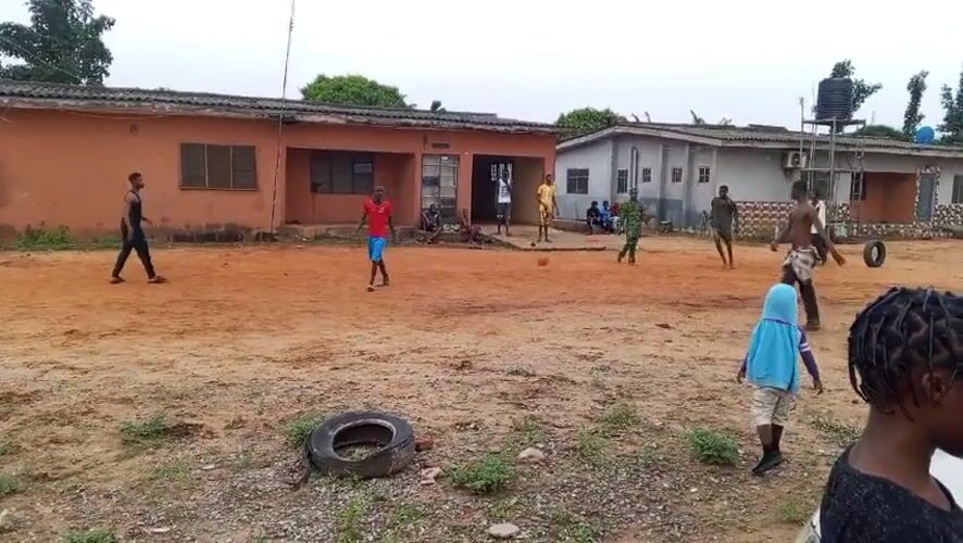 Soccer match played on dirt field in Badagry, Nigeria