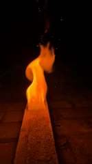 Wooden plank burns with flames in Прикамский, Russia