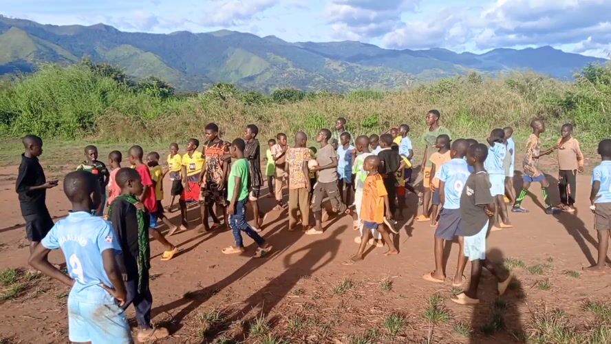 Children play soccer, adults learn tailoring in rural Congo community