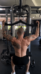 Tattooed man completes early morning workout in Pleven gym