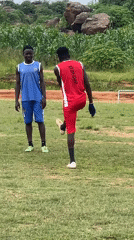 Two-team soccer training session on a Jos, Nigeria field
