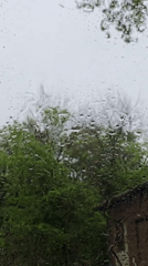 Driver documents rainy afternoon through windshield and car interior