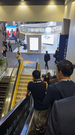 Overhead view of escalator traffic at a Bangkok convention hall