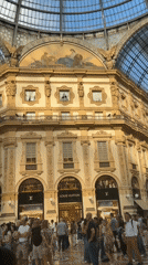 Street activity and grand architecture in central Milan