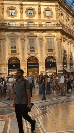 Street activity and grand architecture in central Milan
