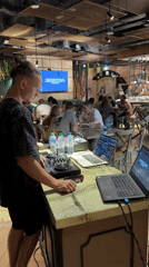 DJ performs at Dubai restaurant while patrons relax nearby