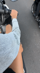 Scooter rider travels road in South Denpasar morning commute