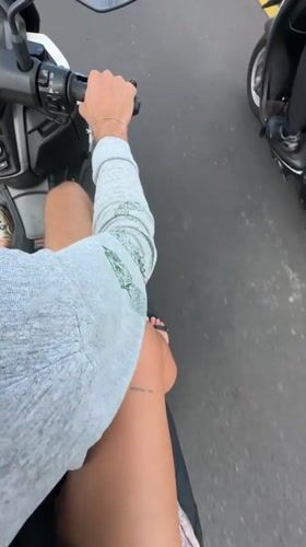 Scooter rider travels road in South Denpasar morning commute