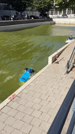 Urban canal surfing session draws multiple participants in Rotterdam