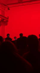 Red-lit stage performance draws audience in Moscow