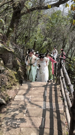 Tourists in traditional dress visit Wulingyuan Scenic Area