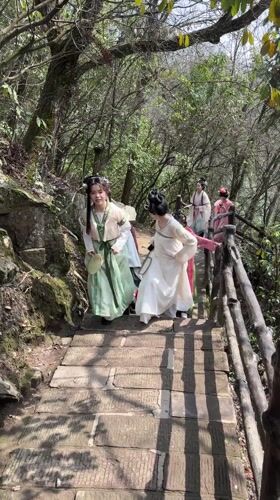 Tourists in traditional dress visit Wulingyuan Scenic Area