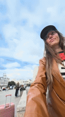 Selfies and a pink suitcase outside Kazansky Railway Station