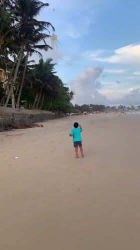 Families enjoy beach day activities along Sri Lankan coast