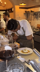 Chefs prepare poached egg dish in Mengwi kitchen