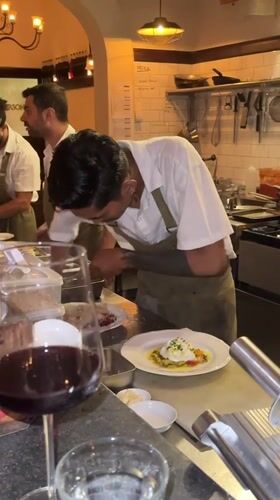 Chefs prepare poached egg dish in Mengwi kitchen