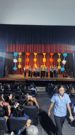 Children's choir performs at Juan Griego auditorium amid community gathering