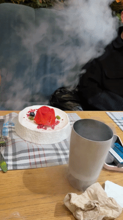Theatrical dessert presentation with smoke effects documented in Sofia restaurant