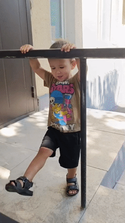 Child on steps and ramp outside a Taraz building