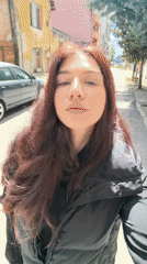 Woman takes selfies indoors in Stara Zagora, Bulgaria