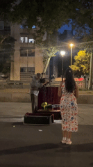 Barcelona's Palau de la Generalitat at night, with street performance nearby