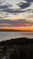 Warm sunset over calm Adriatic waters off Makarska