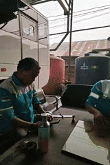 Indonesian workers kill time with dominoes and cash during a break