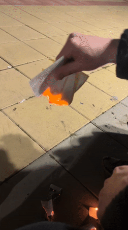 Man displays cartoon cards, burns paper in Bulgarian town