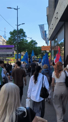 EU and Serbian flags carried in Belgrade street demonstration