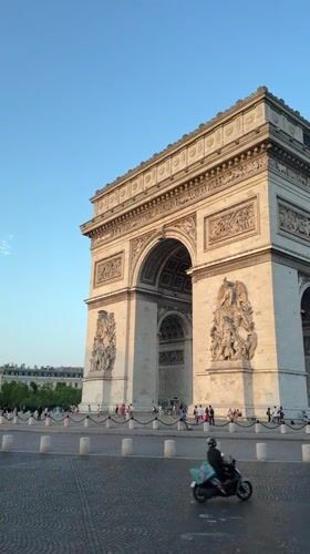 Arc de Triomphe on a clear Paris evening, two angles